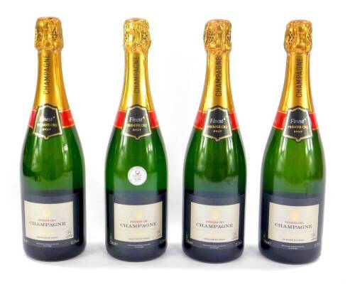 Four bottles of Tesco Premium Cru Champagne.