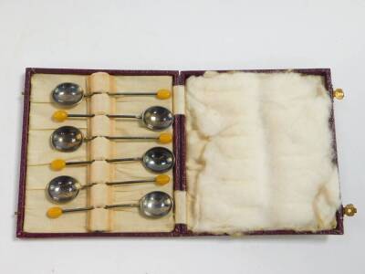 A set of six George VI silver teaspoons, decorated in the Albany pattern, Sheffield 1938, 2.05oz, cased., together with six plated coffee spoons, with bean terminals, cased. - 5