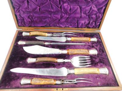 A Victorian composite horn and silver mounted serving set, comprising a pair of fish servers, a pair of carving knives and forks, and a steel, cased, Sheffield 1894 - 98. - 3