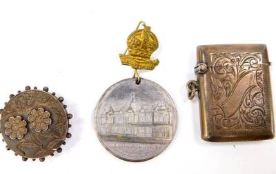 A George V silver vesta case, with foliate engraved decoration, banner reserve, Birmingham 1918, 0.72oz. a Victorian silver hair locket brooch, and a medal 'In Commemoration Of The Opening Of The Municipal Buildings Boston Joseph Cooke Mayor June 16th 190