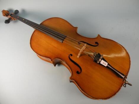 A Hungarian students cello with a carved scroll and ebonised