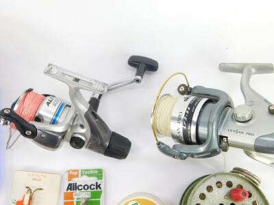 A Shimano Alivio 4000RC fishing reel, Okuma Lexsan Pro LPB-55 fishing reel, Tokoz reel, Hardy's reel box, C Dakron, and various fishing tackle. (quantity) - 2