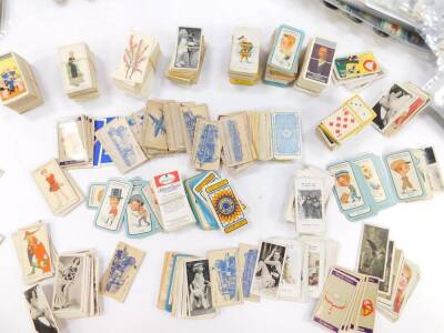 Carerra cigarette cards, part sets including The Nose Game, Tools, Alice In Wonderland, and Fortune Telling, together with further cards. (quantity) - 3