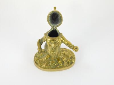 A Victorian brass novelty ink well modelled as Mr Punch, in standing pose, holding a quill and ink well, raised on an oval base, 15.5cm high. - 2