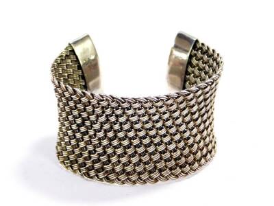 A Suarti silver cuff bangle, of wide basket weave design, 59g.