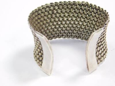 A Suarti silver cuff bangle, of wide basket weave design, 59g. - 2