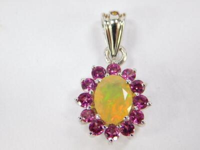 A silver Ethiopian opal and Rajasthan garnet ring, size N/O, together with a matching pendant and earrings, with certificates. - 2