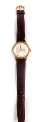 An Omega Seamaster de Ville gentleman's gold plated wristwatch, circular dial with gilt batons, centre seconds, date aperture, on an Omega strap.