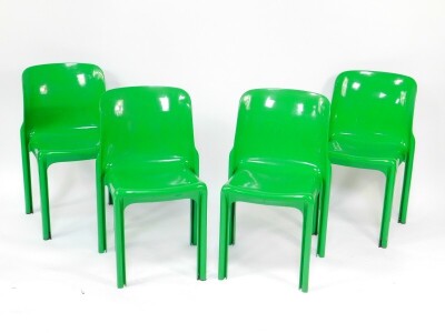 A set of four Vico Magistretti designed green plastic stacking chairs.