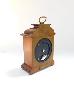 An Elliott of London mahogany cased mantel clock, for Garrard & Company Ltd, 112 Regent Street, silvered square dial with yellow metal spandrels cast as cherubs, chapter ring bearing Roman numerals, clockwork movement, the domed topped square case raised - 5