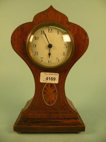 An Edwardian oak mantel clock