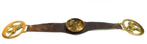 A brass and leather saddle ashtray, 53.5cm wide.