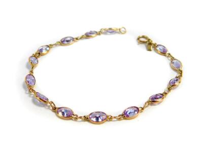 A 9ct rose gold and lilac semi-precious stone set multi link bracelet, on a bolt ring clasp, 3.6g.