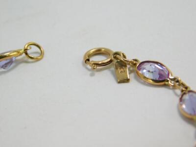 A 9ct rose gold and lilac semi-precious stone set multi link bracelet, on a bolt ring clasp, 3.6g. - 2