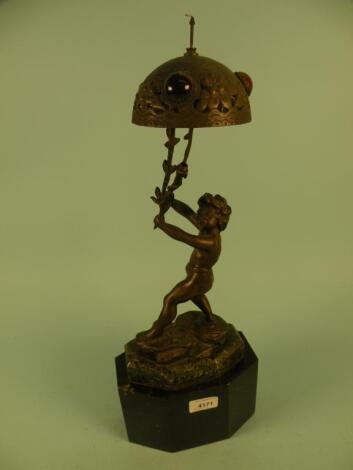 Pyce. A French bronzed spelter table lamp in the form of a young child