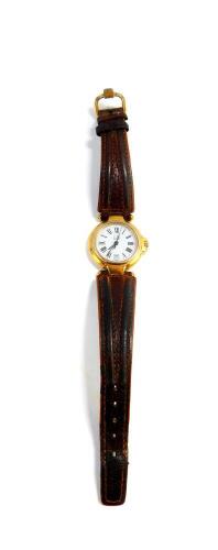 A Dunhill ladies stainless steel and gold plated wristwatch, circular white dial bearing Roman numerals, centre seconds, date aperture, quartz movement, serial number P12 20452, on a leather strap.