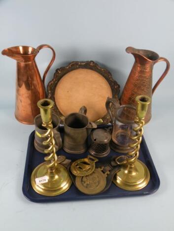 A pair of brass spirally fluted candlesticks