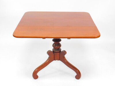 A Victorian mahogany tilt top breakfast table, the curved square top raised on a baluster turned column over three S scroll legs, 74cm high, 92cm wide.