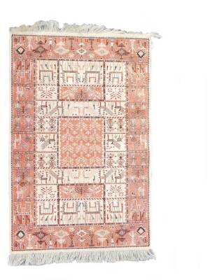 A Caucasian silk rug, decorated with animal and tree motifs against a red and cream ground, 120cm x 70cm.