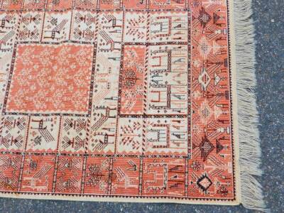 A Caucasian silk rug, decorated with animal and tree motifs against a red and cream ground, 120cm x 70cm. - 2