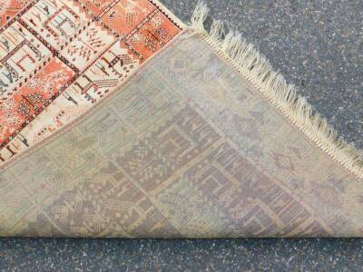 A Caucasian silk rug, decorated with animal and tree motifs against a red and cream ground, 120cm x 70cm. - 3