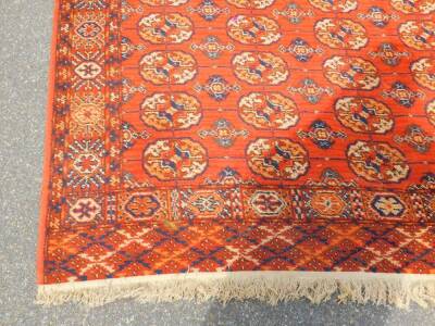 A Tekke red ground rug, decorated with seventy five guls and other geometric motifs, 313cm x 191cm. - 2