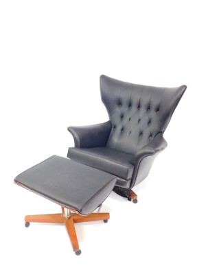 A G-Plan Blofeld black vinyl swivel chair, model 6250, on a walnut frame on castors, together with a matching stool. (2)