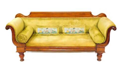 A late Regency mahogany scroll end sofa, upholstered in green draylon raised on baluster turned legs, 207cm wide.