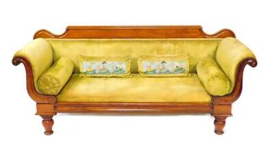 A late Regency mahogany scroll end sofa, upholstered in green draylon raised on baluster turned legs, 207cm wide.