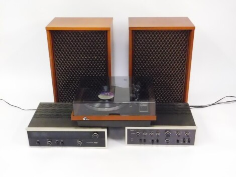 A Sansui record player, SR-4050C, stereo amplifier, AO-7500, and an AM/FM stereo tuner, TU-9500, together with a pair of four way speakers, SP-3500. (5)