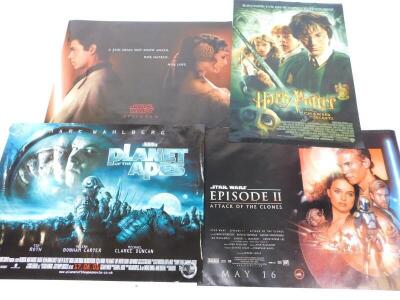 Four film posters, comprising Harry Potter and The Chamber of Secrets, Planet of The Apes, and two posters for Star Wars Episode II, Attack of the Clones.