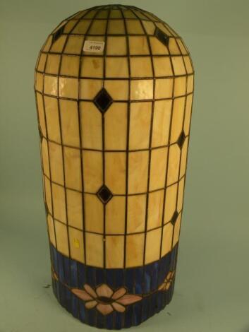 A Tiffany style wall light with stained leaded glass