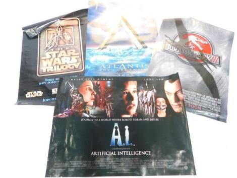 Four film posters, comprising Atlantis The Lost Empire 2001., AI (Artificial Intelligence)., Jurassic Park III., and The Star Wars Trilogy, Special Edition, Three Reasons Why They Build Movie Theatres.