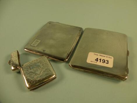 A silver engine turned cigarette case