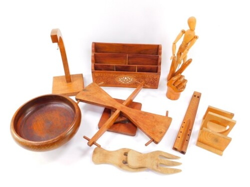 A group of treen, including a carved Indian stationery rack, 31cm wide, banana stand and fruit bowl, hand carving artist model, etc. (qty).