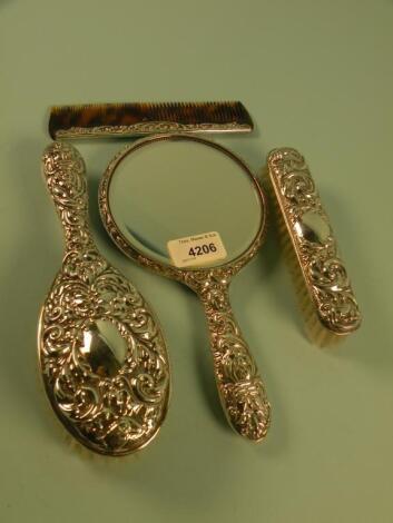 A silver mounted dressing table set