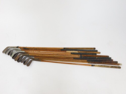 Ten vintage golf clubs, all irons with wooden shafts, to include one for Lilywhites Ltd of London., and one by Harris of Montrose, another by Anderson & Blyth of St Andrews., and another by Hawkin's of Walsall.