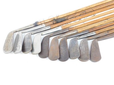 Ten vintage golf clubs, all irons with wooden shafts, to include one for Lilywhites Ltd of London., and one by Harris of Montrose, another by Anderson & Blyth of St Andrews., and another by Hawkin's of Walsall. - 2