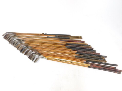 Twenty vintage golf clubs, all irons with wooden shafts, to include makers Archie Tait of Port Patrick., C R Buckle., E L Cheal., F Frow of Gainsborough, etc.