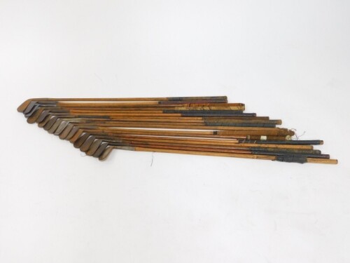 Vintage golf clubs, all irons with wooden shafts. (17)