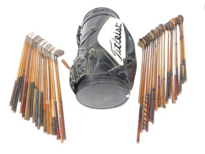 A large Titleist golf or display bag, containing a collection of vintage drivers, mainly wooden shafted, and a selection of wedges and irons, all wooden shafted. (39) - 3