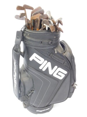 A Ping golf bag, containing a selection of vintage wooden shafted irons and putters, makers to include P McLeod, Lincoln. (26)