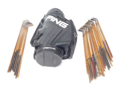 A Ping golf bag, containing a selection of vintage wooden shafted irons and putters, makers to include P McLeod, Lincoln. (26) - 2