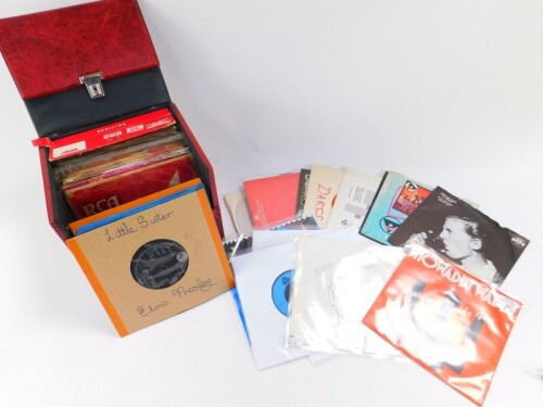 Elvis Presley. A collection of 45rpm records, to include Are You Lonesome Tonight., I Just Can't Help Believin'., Shake Rattle & Roll., Jailhouse Rock., King Creole, etc. (56)., together with other 45rpm records in a red vinyl carry case. (quantity)