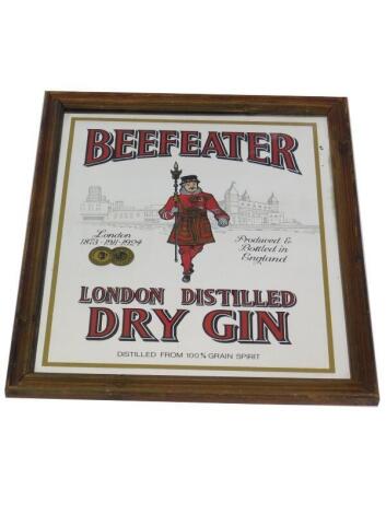 A Beefeater London Distilled Dry Gin advertising mirror, oak framed, 58.5cm high, 48.5cm wide.