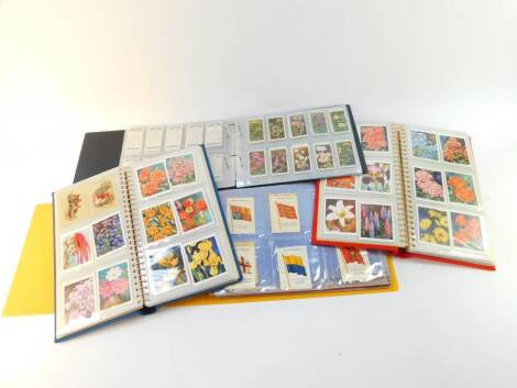 Cigarette cards, large scale, sets and part sets, including Wills's Famous British Authors, Butterflies and Moths, Garden Flowers, and The King's Art Treasures, silk cigarette cards including Flags of The British Empire, and Carreras Alice In Wonderland p