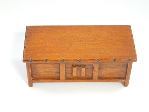 A Talent oak music box carved as a blanket chest, 8.5cm wide, 8.5cm deep.