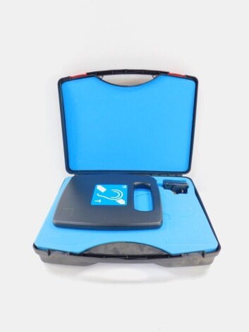 A portable audio frequency induction loop system (AFILS), with charger in fitted carrying case.