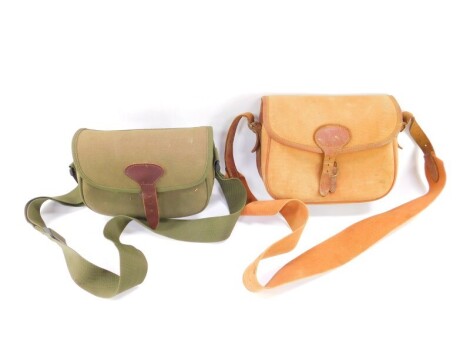 A Brady canvas and leather cartridge bag, and another green canvas cartridge bag. (2)