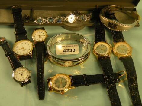 A quantity of modern gent's and ladies dress watches